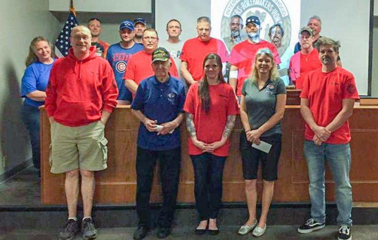 Members of Local 158 wear red to raise funds for Honor Flights. They donated $2,100 to Honor Flights at their May meeting. 